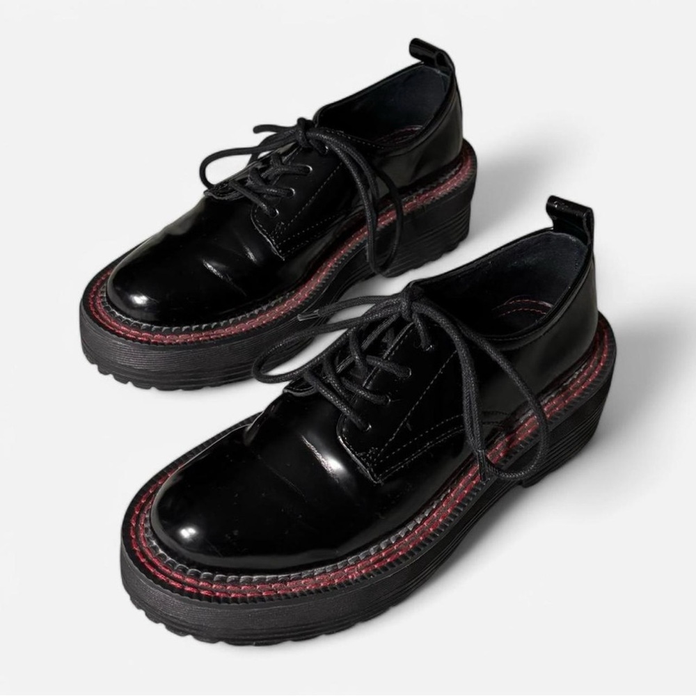 Black platform oxfords with red stitching